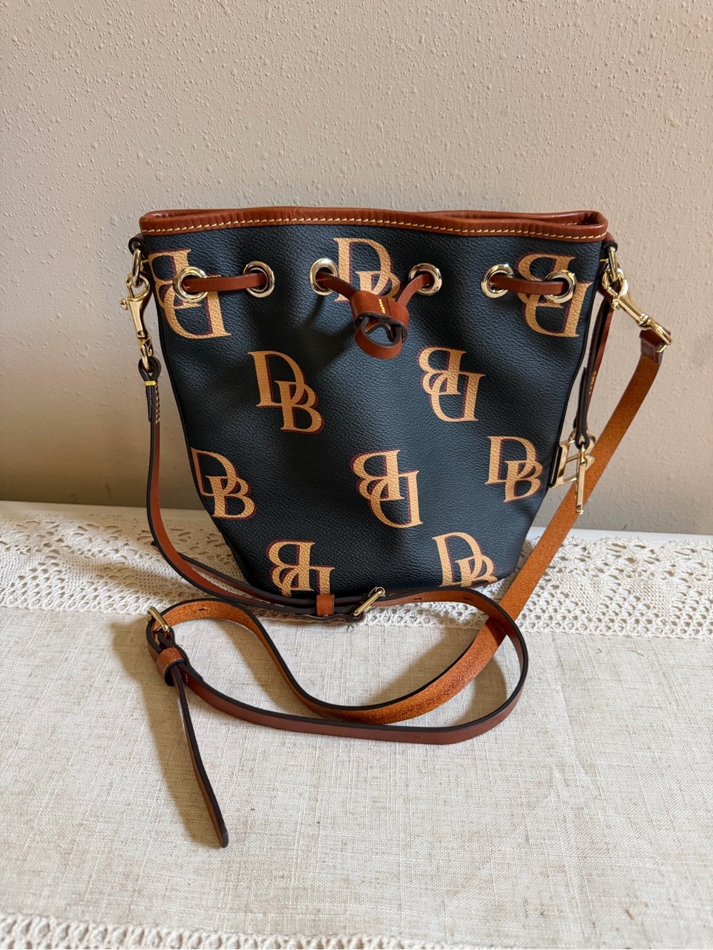 Dooney & Bourke Brown Black 
DB Logo Bucket Crossbody Drawstring Charm Pockets